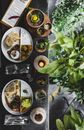 Top view composition of assorted delicious Asian dishes served with drinks and decorative elements in stylish summer cafe