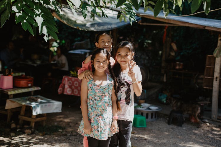 Cheerful Little Asian Kids Spending Time On Street