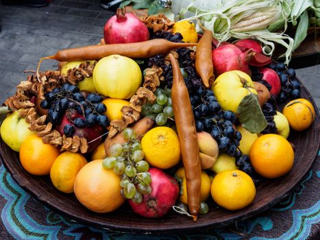 Assorted ripe healthy fruits composed with traditional Georgian sweets