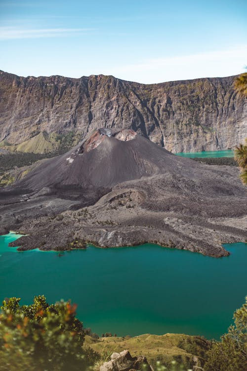 Wonderful scenery of mountains and volcano amidst blue water lake