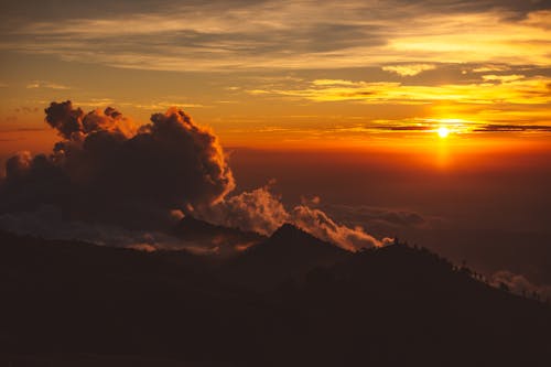 Amazing bright sunset over mountainous terrain