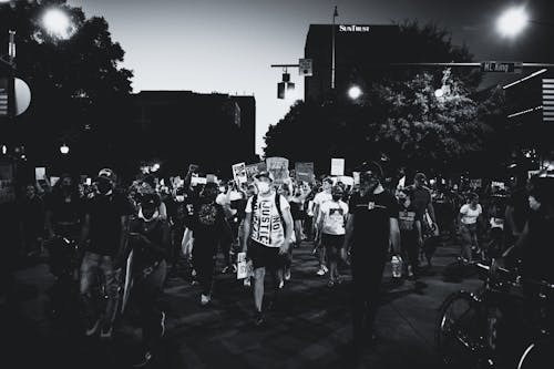 Grayscale Photo of People Walking on Street