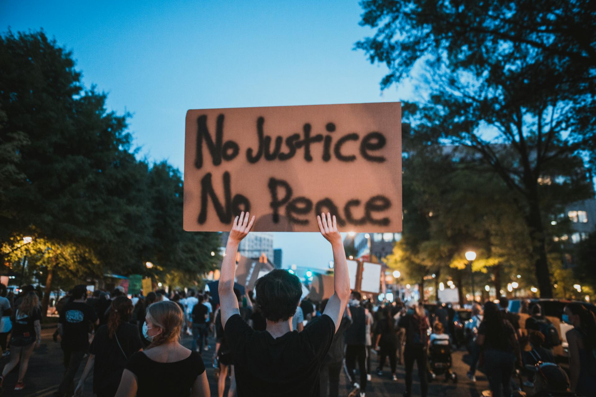 Protester Holding a Sign