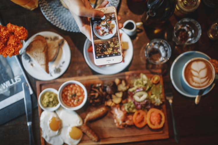 Faceless Person Taking Picture Of Breakfast