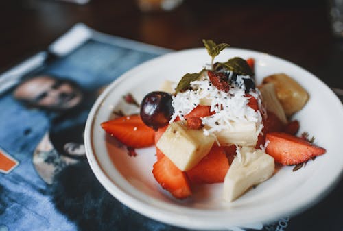 Delicious fruit dessert with mint leaf on top