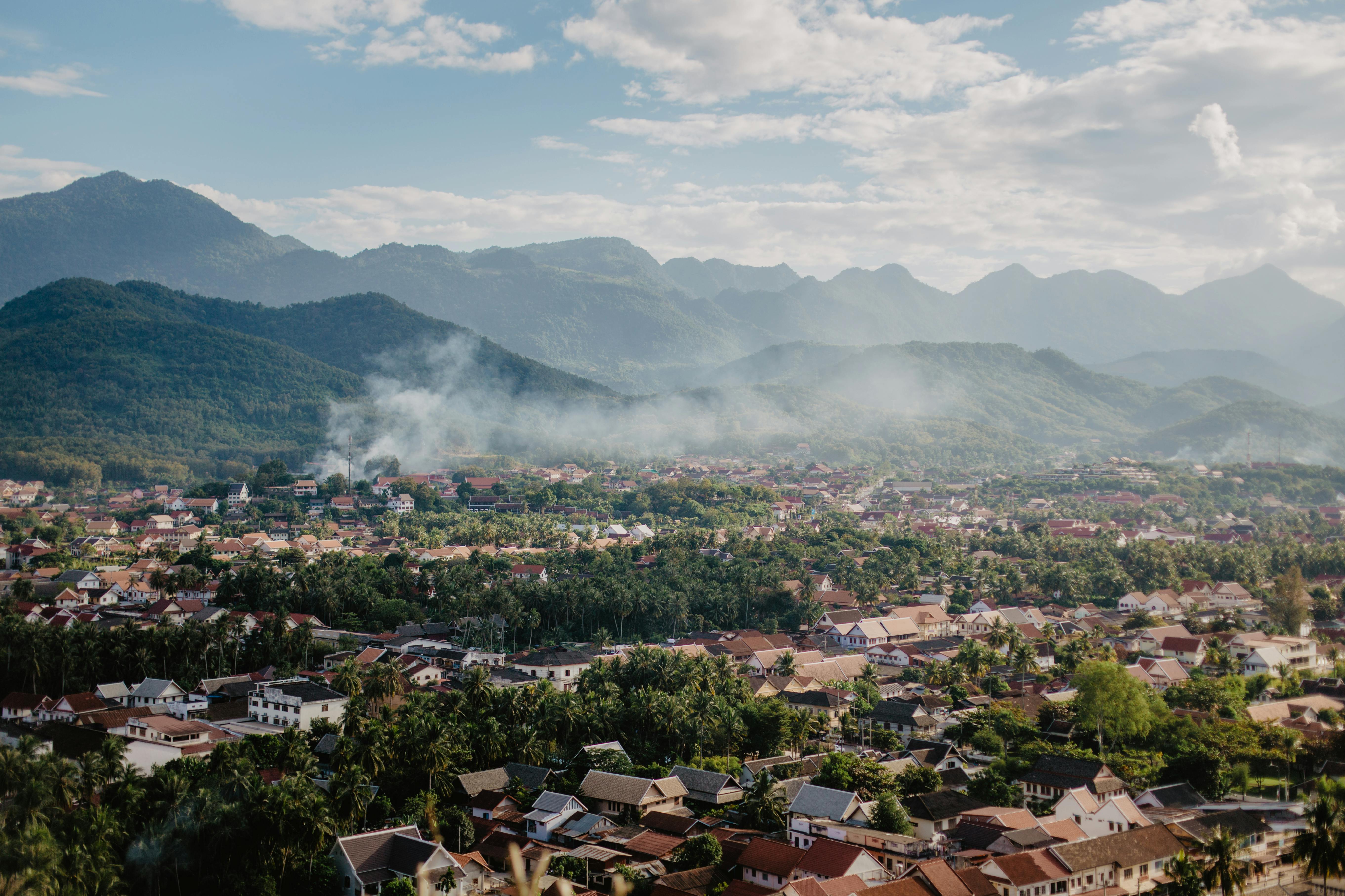 View over Luang Prabang from Mount Phousi, showing rivers and rooftops