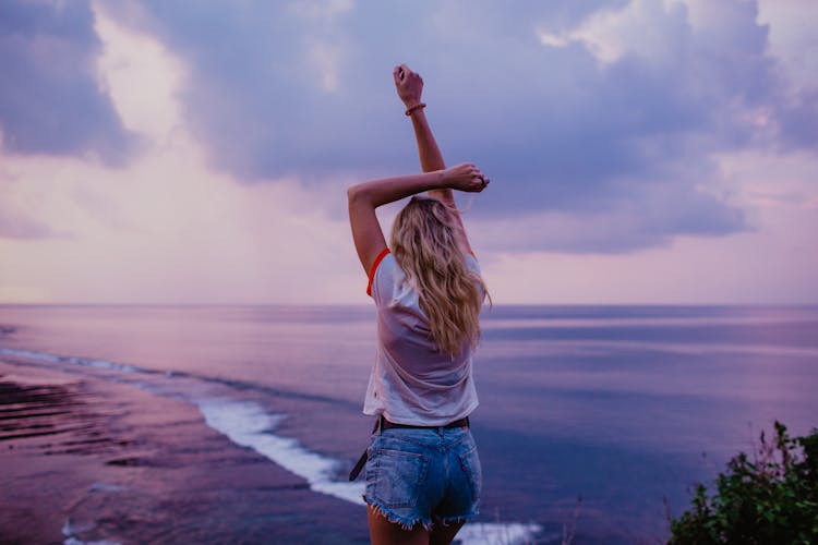 Slim Woman Enjoying Endless Seascape On Beach