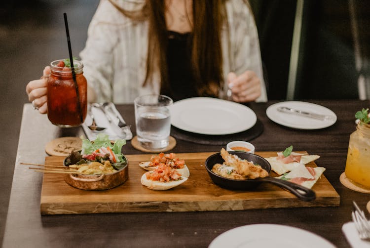 Crop Woman In Asian Cuisine Restaurant