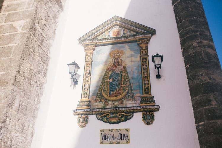 Our Lady Of Oliva Tile Painting On The Church Wall In Spanish Town Of Vejer De La Frontera