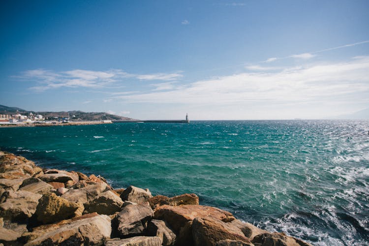 Beach Along Emerald Waters 