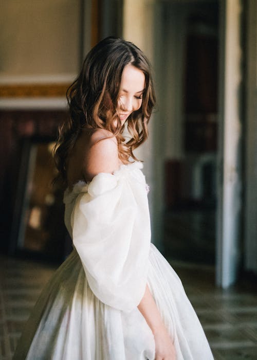 Woman in White Off Shoulder Dress