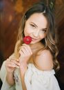 Woman Posing Holding a Red Flower