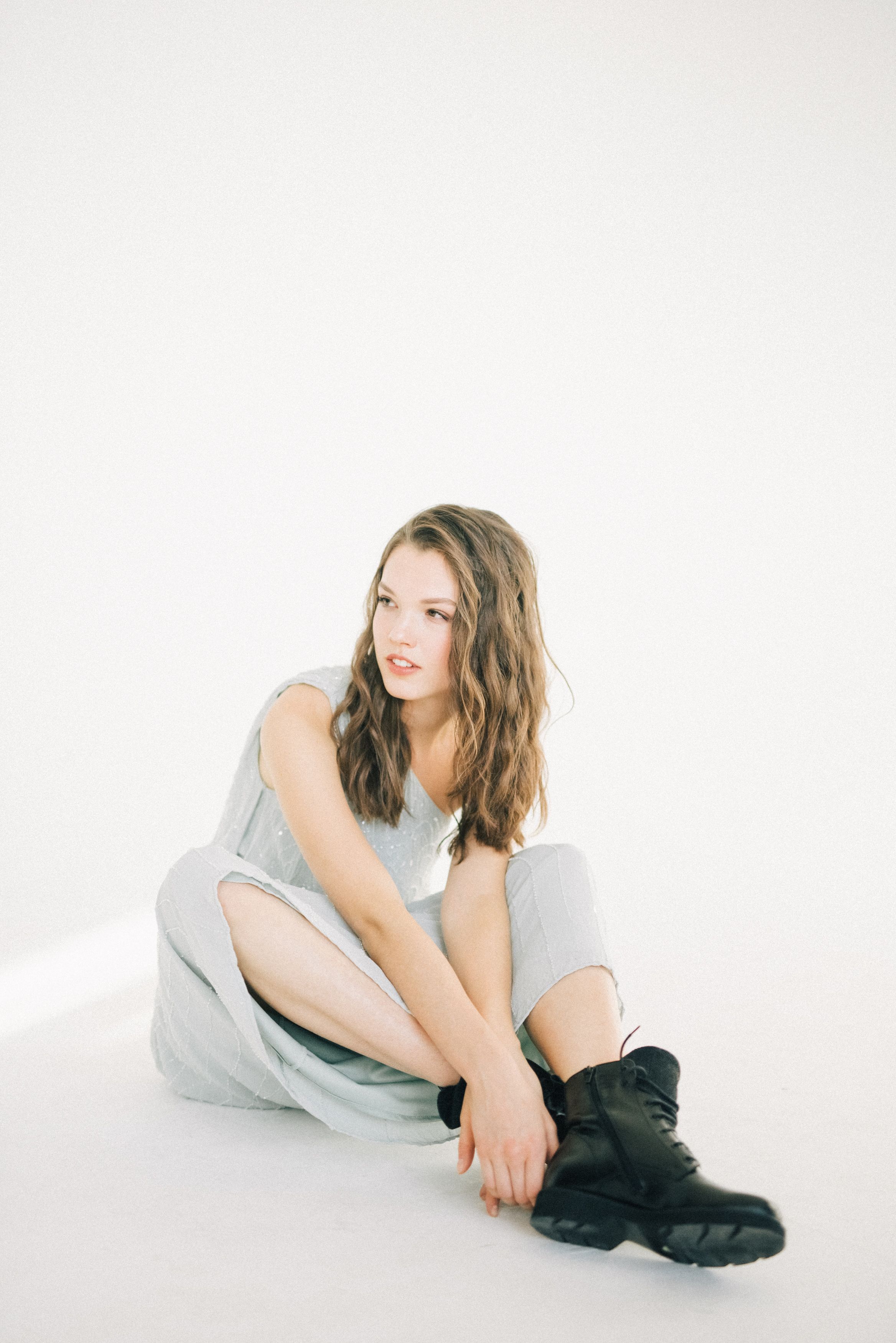 Woman in a Dress Sitting on a Chair · Free Stock Photo