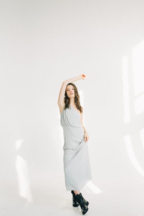 A Woman in White Sleeveless Dress