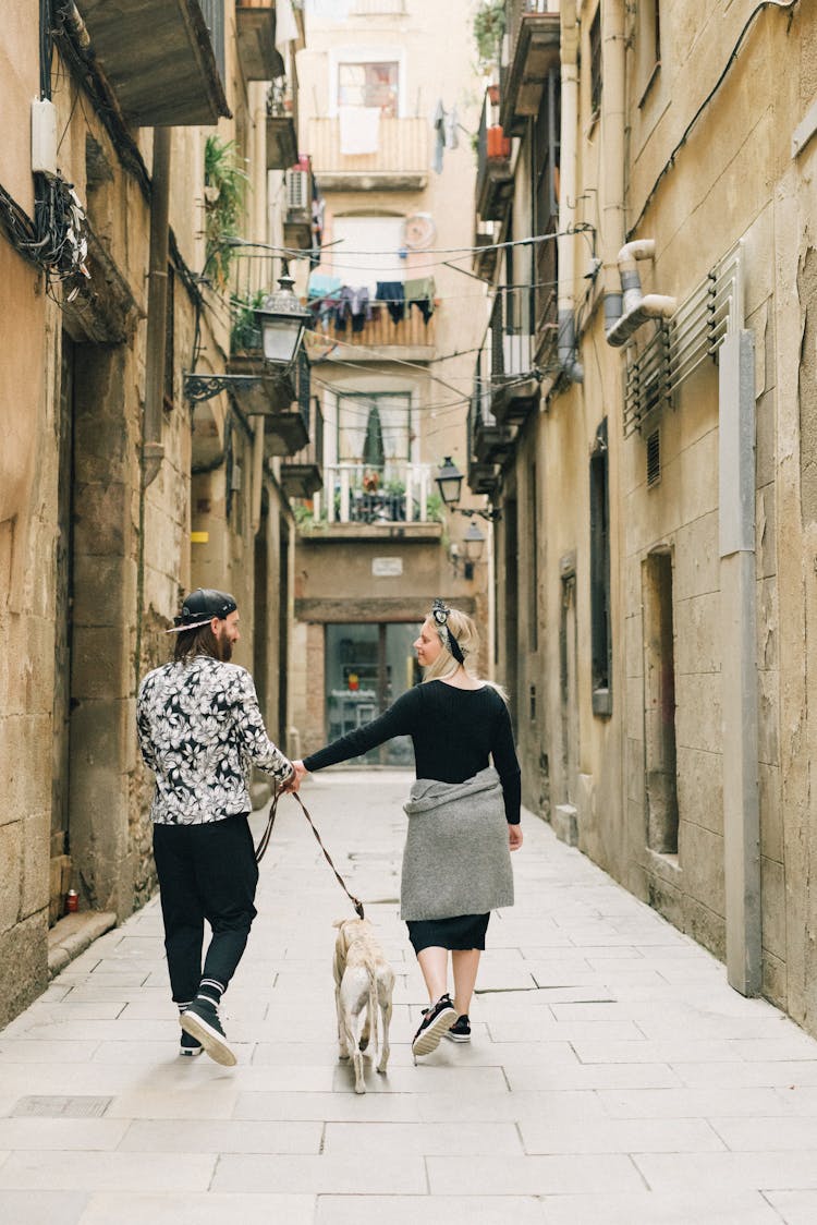 A Couple Walking On The Street