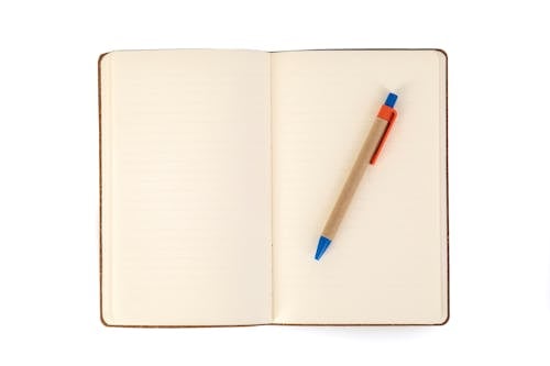 White Notebook With Blue Pen
