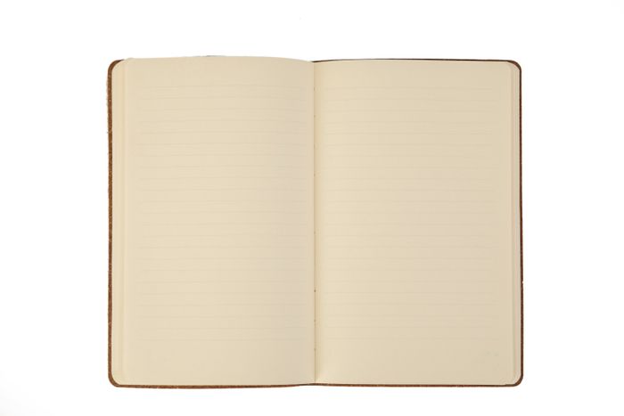 Open ruled notebook on white — photo by Engin Akyurt on Pexels