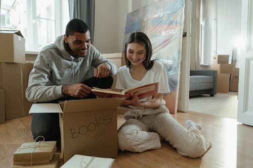 Man and Woman Sitting on Couch