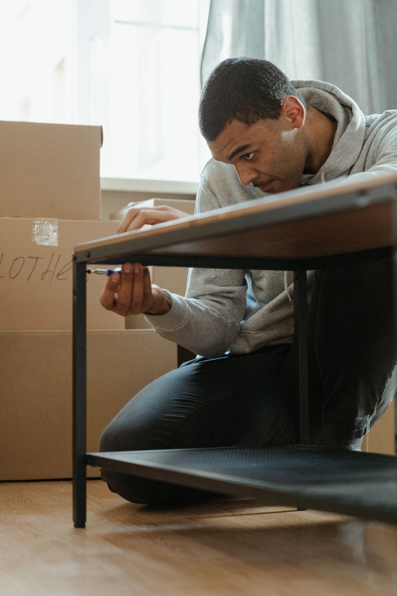 Lampard team member assembling a coffee table at the destination