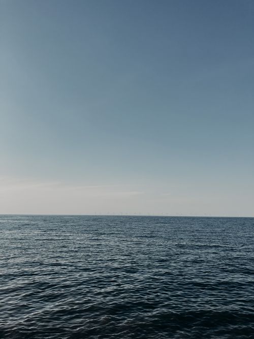 Free Picturesque seascape of blue rippling surface of endless sea under bright clear sky Stock Photo