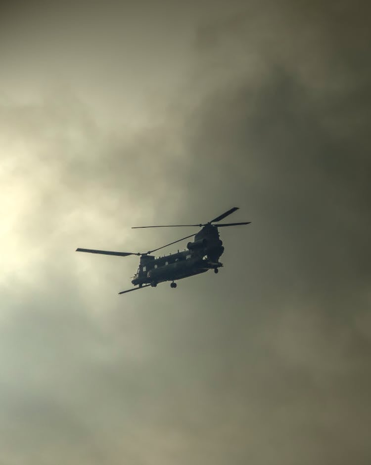 Black Helicopter Flying In The Sky