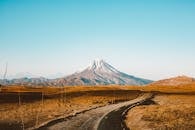 Landscape of road leading to distant mountain