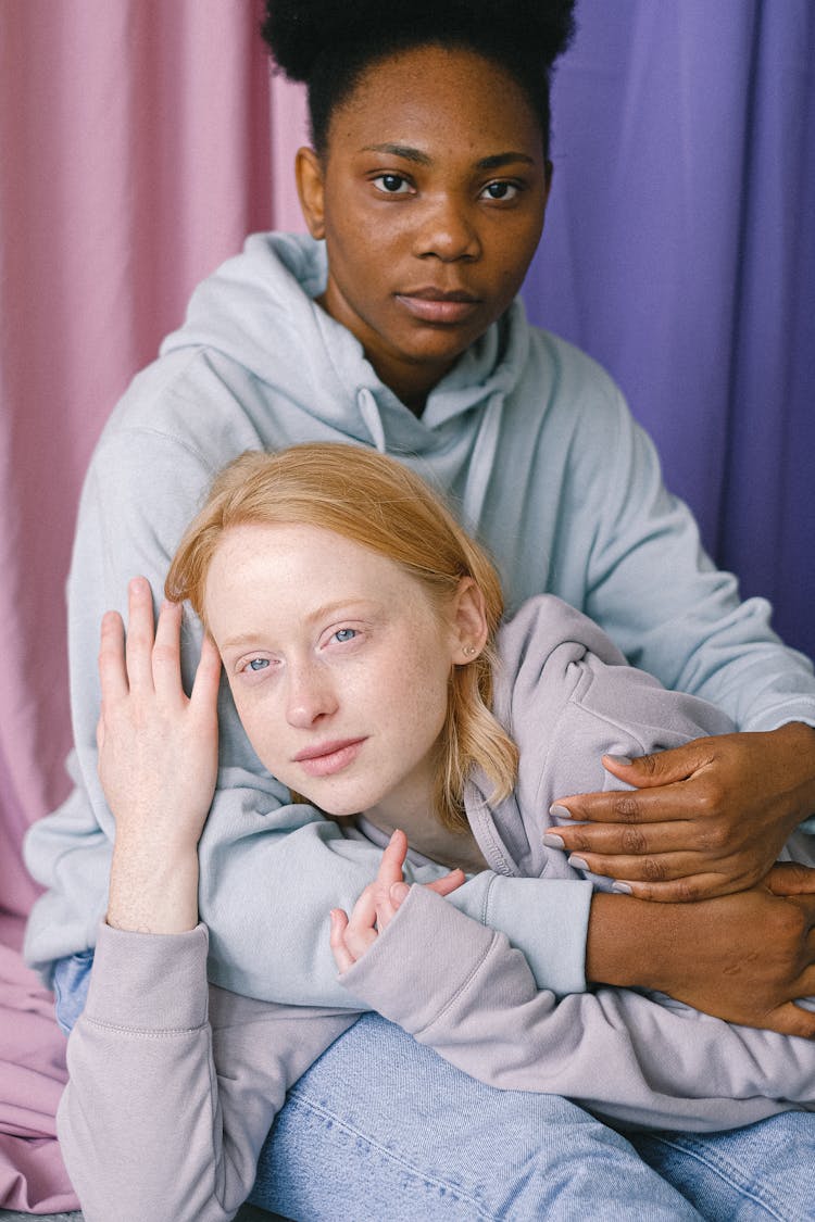 Couple In Hoodies Hugging Each Other