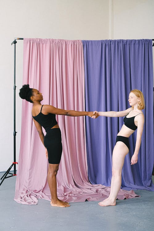 Interracial Women Balancing with Hands