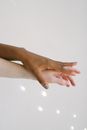 Interracial Peoples Hands on Top of Another