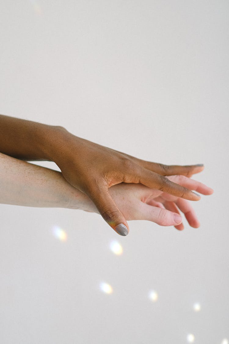 Interracial Peoples Hands On Top Of Another