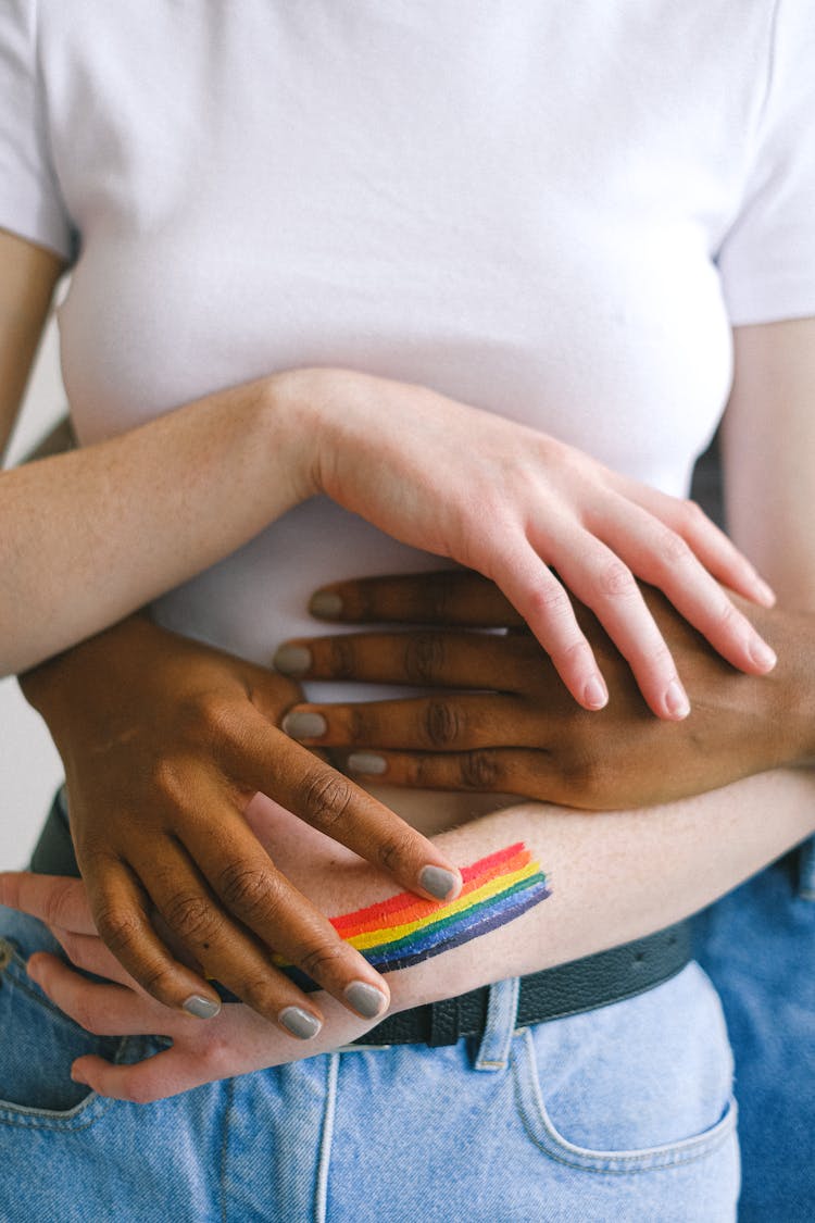 Hands Holding A Woman In A White Tshirt