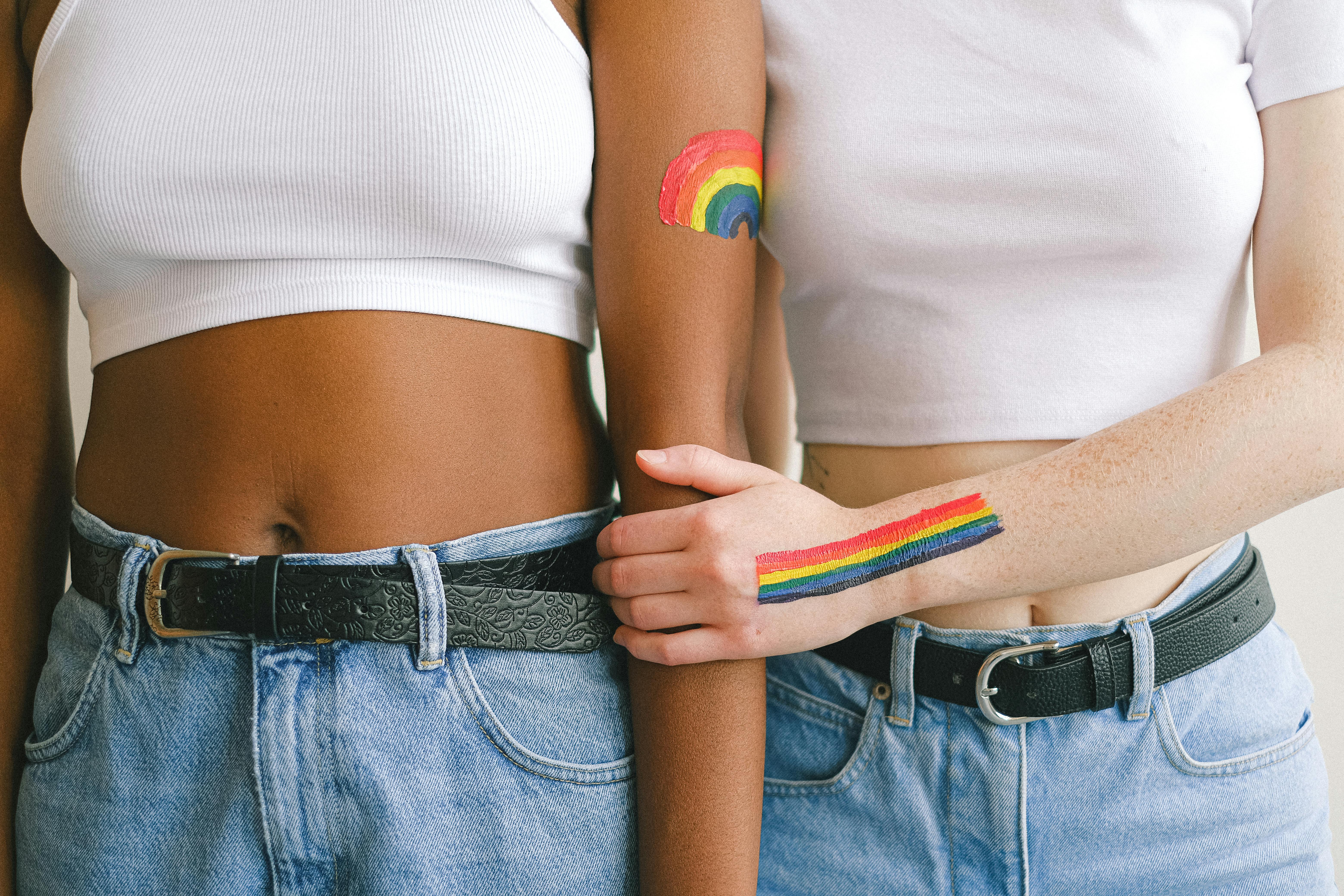 women with gay pride body paint