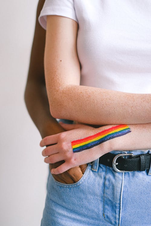 Free Woman With a Gay Pride Body Paint on her Hand Stock Photo
