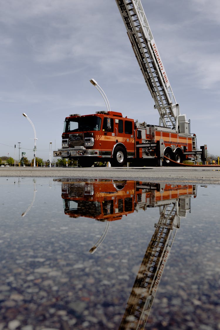 Red Fire Truck Parked On Concrete Pavement