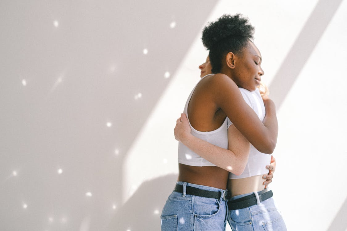 Free Women Hugging Each Other Stock Photo