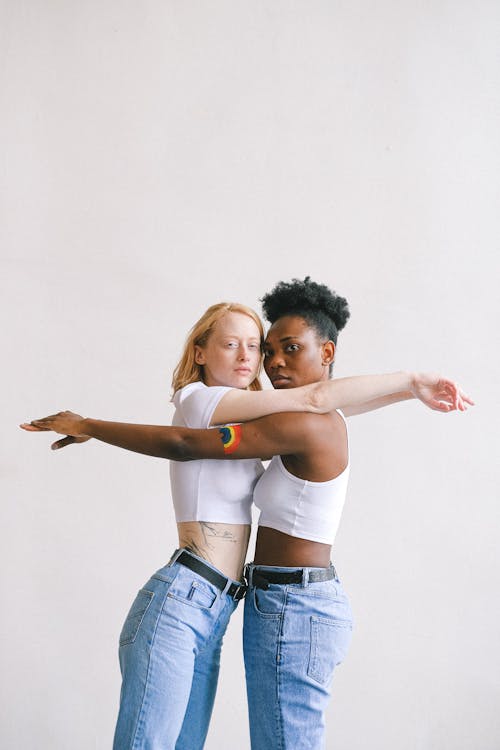 Women With Arms Outstretched Looking at the Camera