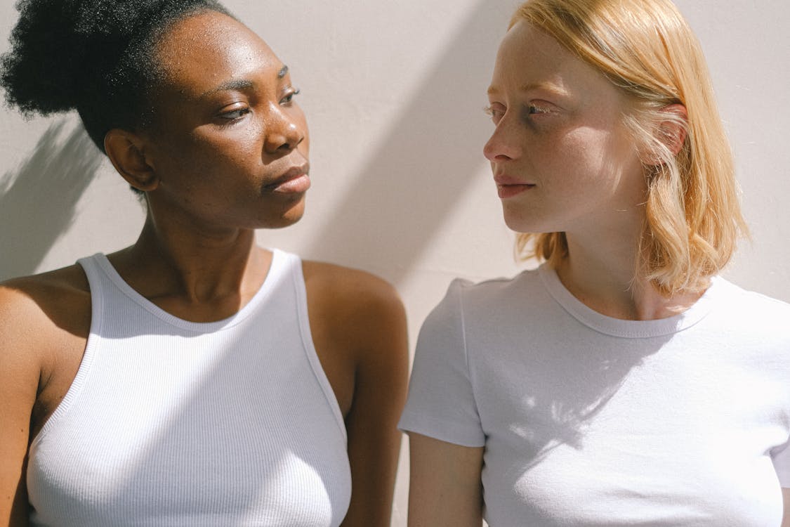Free Women Looking at Each Other Stock Photo