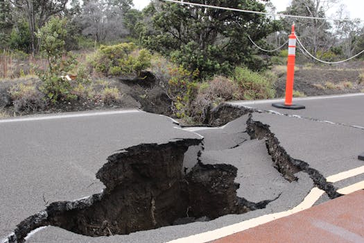 Severe road damage with large cracks in Volcano, Hawaii caused by an earthquake.