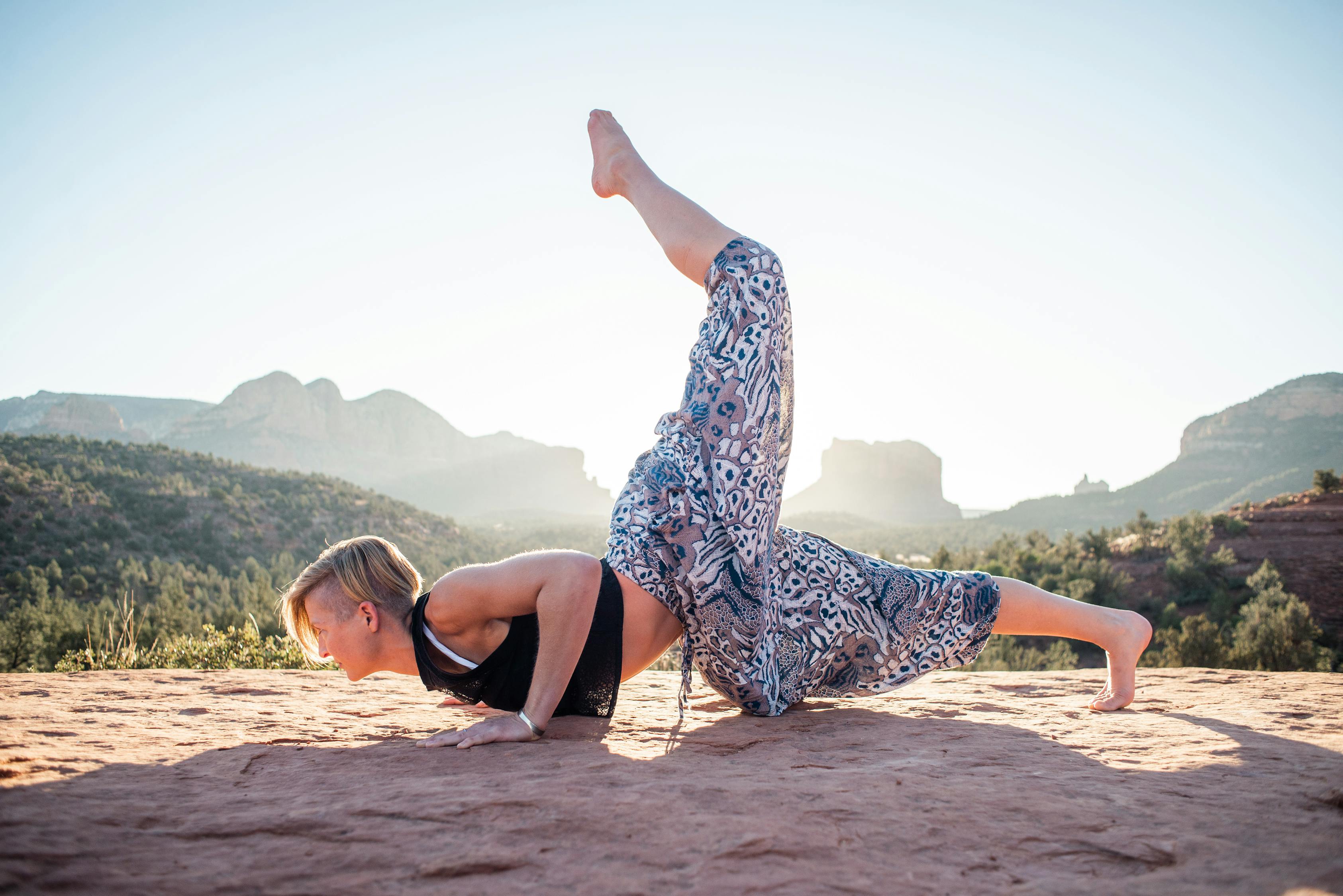 Woman doing One Legged Chin Stand in nature · Free Stock Photo