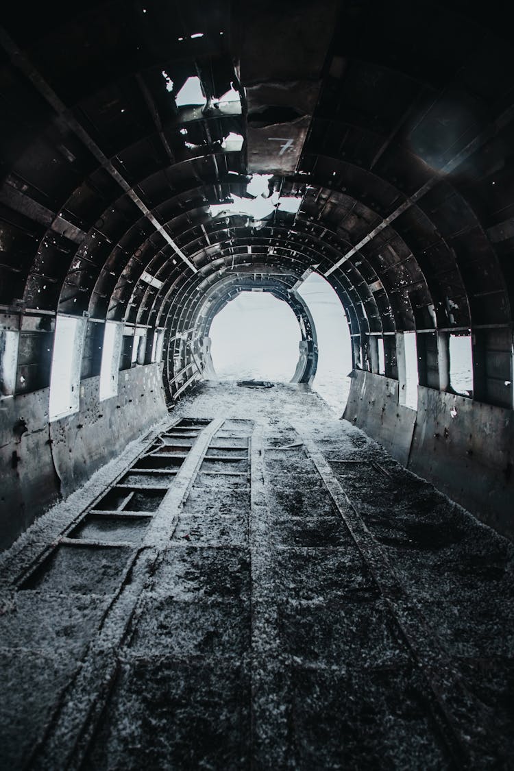 Disused Old Grey Aircraft With Snow On Floor