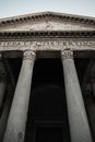 Low angle of gray granite Corinthian portico columns of famous Pantheon in Rome