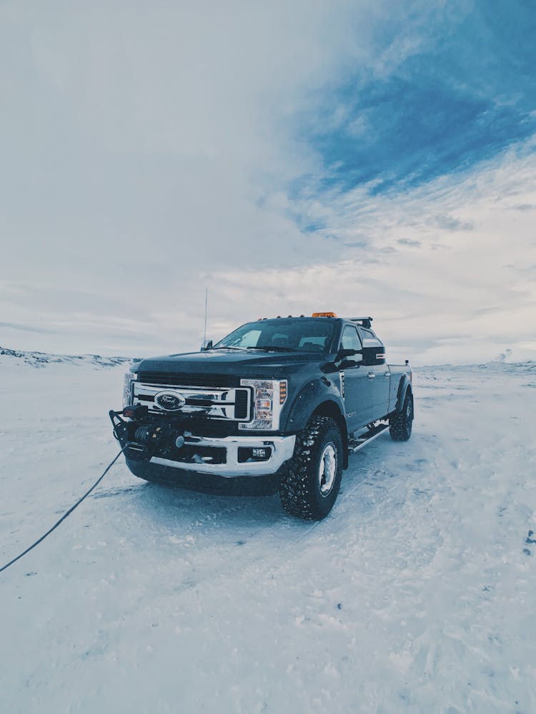 Car Driving On Snowy Road