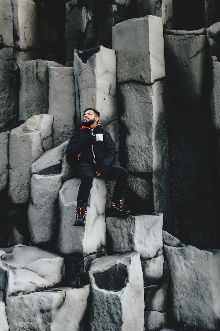 Traveler On Amazing Basalt Columns On Shore