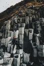 Traveler on basalt columns of high mountain