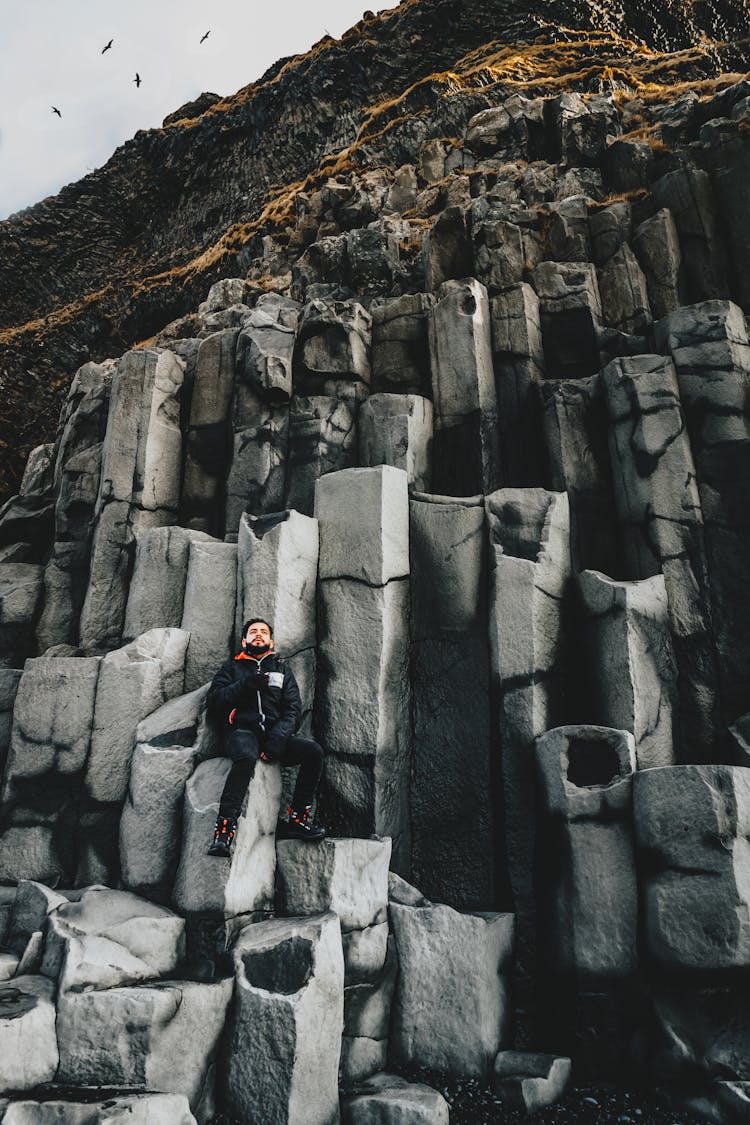 Traveler On Basalt Columns Of High Mountain