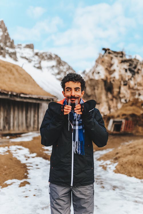 Playful guy with icicle tusks in nature · Free Stock Photo