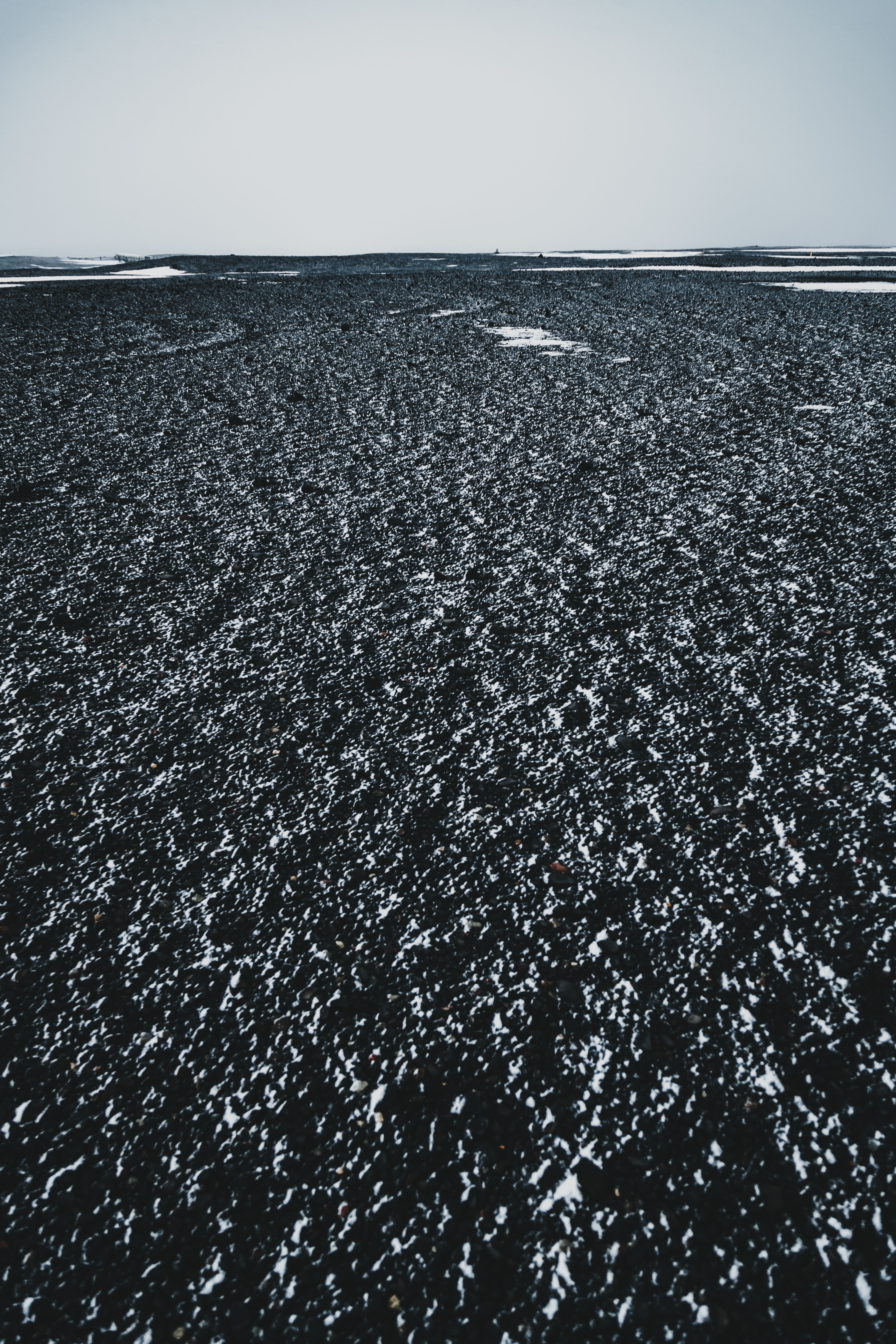 Uneven endless ground under white sky in winter · Free Stock Photo