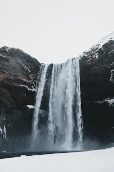 Frozen beauty of Seljalandsfoss waterfall in Iceland during wintertime.