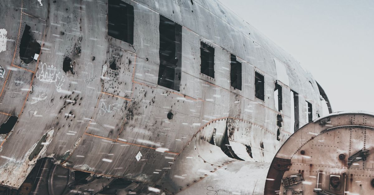 Crashed Plane Engine Crashed aircraft with destroyed engine on snowy surface · Free Stock Photo