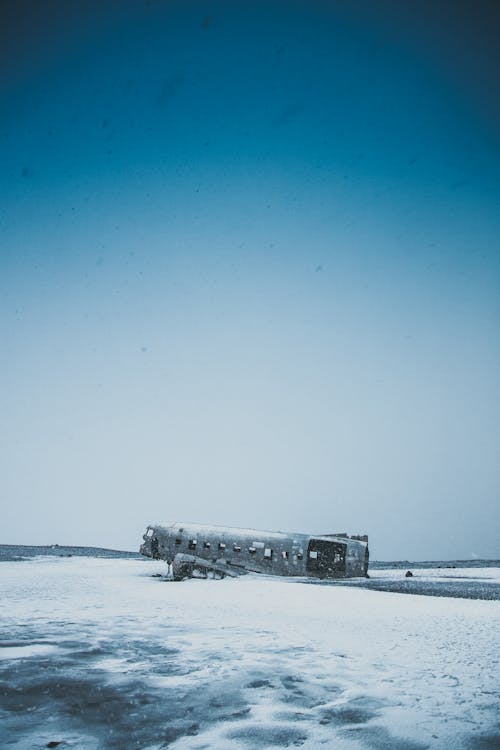 Abandoned plane after accident on snowy land